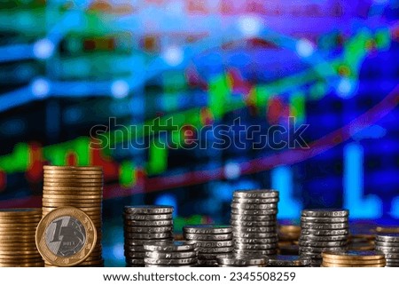  Coin with DREX written on a stack of coins in a financial market chart