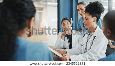 Doctors, nurse and women on clipboard in meeting, collaboration or teamwork for hospital planning, medical or life insurance. Talking, leadership and healthcare workers on paper in diversity research Royalty-Free Stock Photo #2345511891