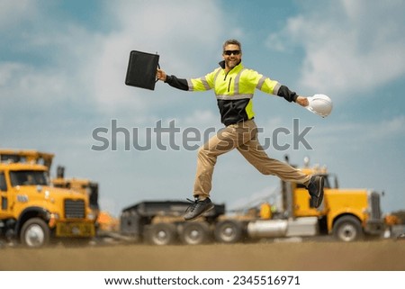 Fast building. Funny construction worker jumping. Excited jump of builders in helmet. Worker in hardhat. Construction engineer in builder uniform jump. Excited foreman jump. Speed build. Royalty-Free Stock Photo #2345516971