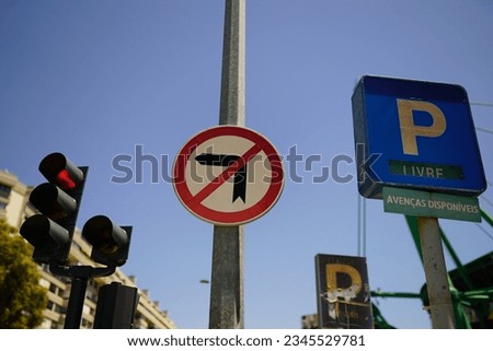 A Low angle of parking and no left turn sign in the street