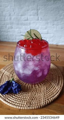 Honey Lime Butterfly Pea Drink with Strawberry Pop Pearl