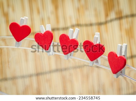 Five red love heart clips