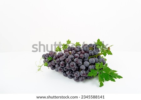 fresh fruit Purple grape Kyoho Grape with leaves isolated on white background