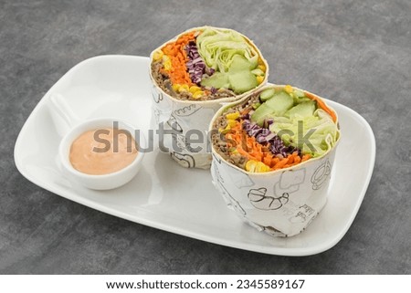 Salad Wrap. Tortilla wraps with beef teriyaki and fresh vegetables. Served with mayonnaise sauce
