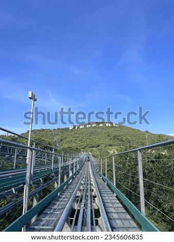 Alphine Coaster Rising to the Vinpearl Hill Royalty-Free Stock Photo #2345606835