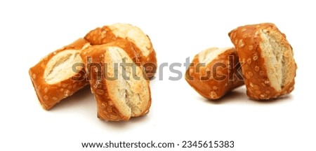 Cheese filled, bite-sized pretzel sticks on white background  Royalty-Free Stock Photo #2345615383