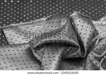 Fabric with a metallic sheen in small polka dots. black. Sometimes you just need to add a fabric, such as our silk.