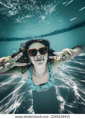 Young Teenage Girl Underwater Photoshoot with Shades