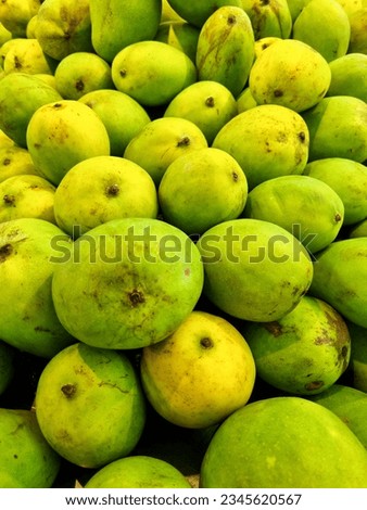Fresh green manggo for sale at traditional market. Selective focus