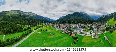 Aerial, panoramic view of Kranjska Gora is a town in Slovenia, on the Sava Dolinka River in the Upper Carniola region. Kranjska Gora is best known as a winter sports town. Royalty-Free Stock Photo #2345621575