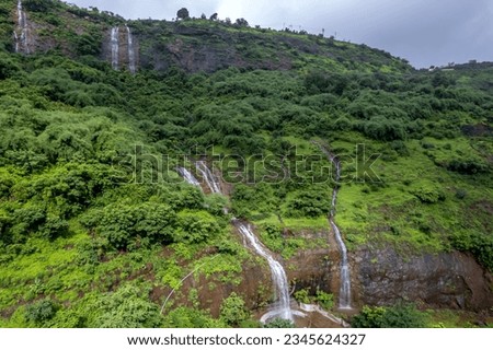 Aerial footage of a monsoon season waterfall near Pune India. Monsoon is the annual rainy season in India from June to September. Royalty-Free Stock Photo #2345624327