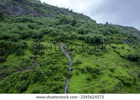 Aerial footage of a monsoon season waterfall near Pune India. Monsoon is the annual rainy season in India from June to September. Royalty-Free Stock Photo #2345624573