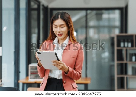 Excited Asian business woman secretary working with product liability, Scarcity, Negotiate, Proposal, Advertising Cost, How to Buy Ads on Any Budget, Interest rate, Dividend, Demand, Remuneration