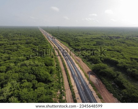 Aerial Yucatan tren maya train green construction trees rail Royalty-Free Stock Photo #2345648599