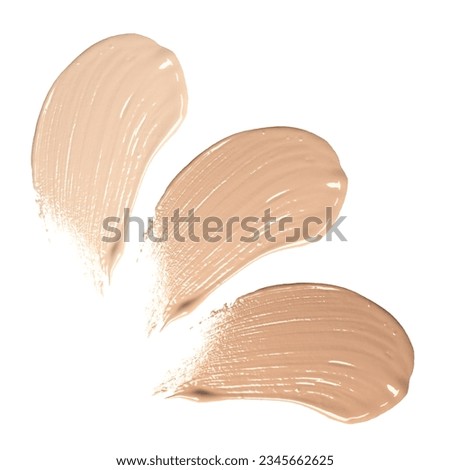 Set of foundation samples in different tones on white background