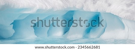 Multi-faceted ice grotto; Nice light on a sculpted iceberg; Panorama, icebergs, cloud mountains; Pastel light, on sculpted icebergs; Scoresby Sund, Greenland