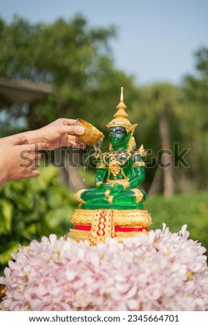 bathing the Buddha image in songkarn day