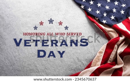 Happy Veterans day concept made from American flag and the text on dark stone background.