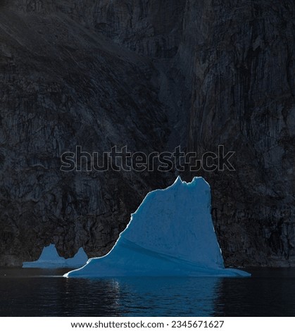 Rim-lit edges; Scoresby Sund, Greenland; Rim-lit iceberg; Scoresby Sund, Greenland