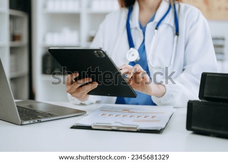 Medicine doctor hand working with modern digital tablet computer interface as medical network concept Royalty-Free Stock Photo #2345681329