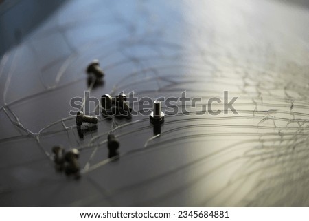 Smartphone with a broken screen and repair tools on the dark background. Royalty-Free Stock Photo #2345684881