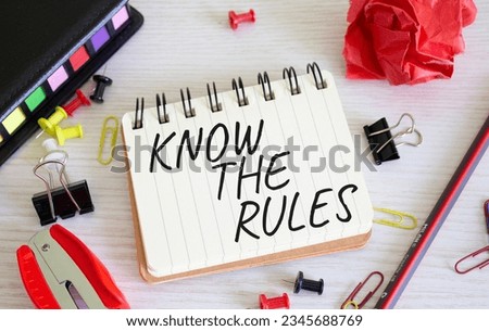 Know the rules symbol. Concept words Know the rules on white notebook. Beautiful wooden background. Business and Know the rules concept. Copy space.