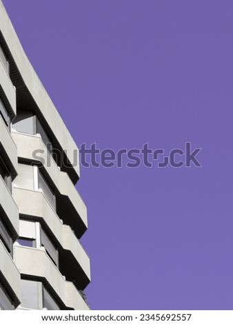 Minimal corner of modernist beige building against clear sky in the city center of Zaragoza, Aragon, Spain. Horizontal photo with backdrop.