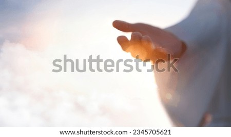 Jesus Christ with open arms reaching out in the sky, hand gestures of Jesus dying on the cross and resurrected, heaven and salvation, faith and love, easter concept
 Royalty-Free Stock Photo #2345705621