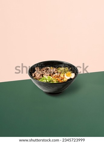Photo of Japanese ramen soup on the background. The perfect picture for a poster. Modern food concept. Advertising for a restaurant. The image is fully sharp, front to back.