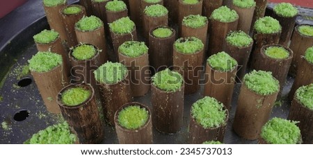 bamboo putu cake is a type of traditional Indonesian snack in the form of a cake filled with palm sugar, grated coconut and rice flour. This cake is steamed in a slightly compacted bamboo tube.