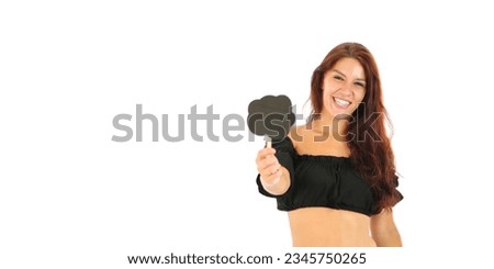 Excited young brunette woman holding a black cloud word symbol against a white background
