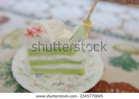 A close-up photograph of a coconut cake that looks delicious