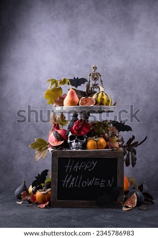 Halloween composition with autumn fruits