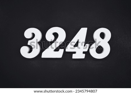 Black for the background. The number 3248 is made of white painted wood.