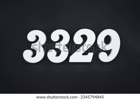 Black for the background. The number 3329 is made of white painted wood.