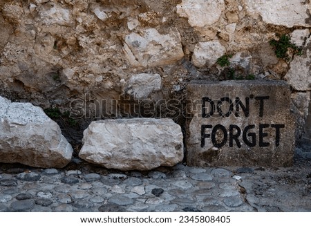 "Don't forget" stone in Mostar, front view