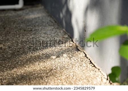 The outer walls of the house are cracked, due to the subsidence of soil and soil beams, earthquakes, substandard construction. Royalty-Free Stock Photo #2345829579