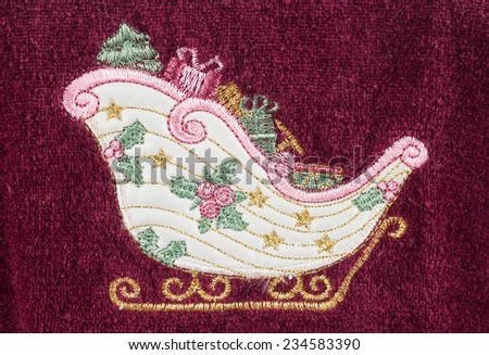 gift boxes in Santa sled hand embroidered on red towel