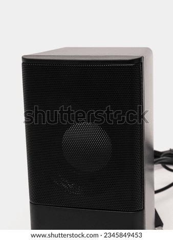 Speakers for a computer on a gray background