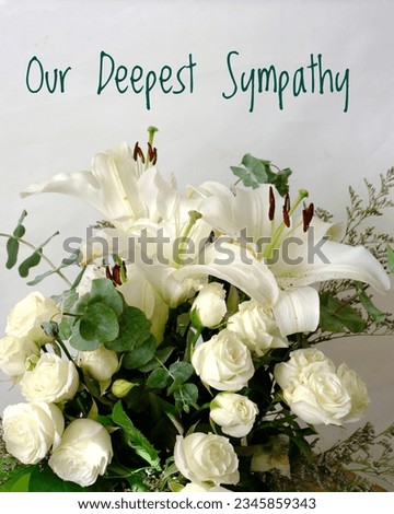 Our Deepest Sympathy card. Vertical photo with white lilies and roses in bouquet with white background and text