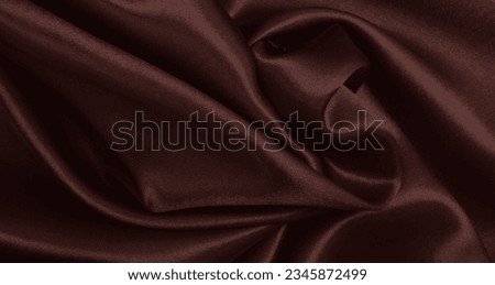 Smooth elegant brown silk or satin luxury cloth texture can use as abstract background. Luxurious background design wallpaper. In Sepia toned. Retro style Royalty-Free Stock Photo #2345872499