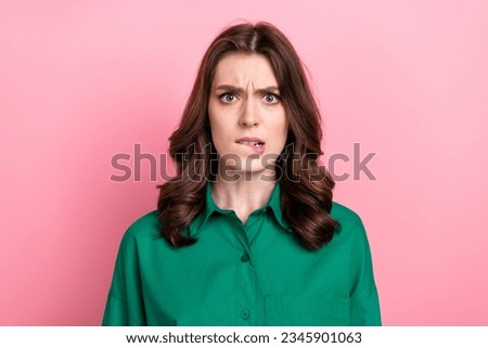 Photo of nervous unsure lady wear green shirt biting lip isolated pink color background Royalty-Free Stock Photo #2345901063