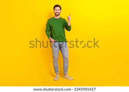 Full body photo of young businessman wear stylish outfit point finger mockup price offer cheap clothes isolated on yellow color background