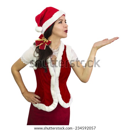 Beautiful Santa girl in red fur costume blowing a kiss, Christmas and New Year image, isolated on white