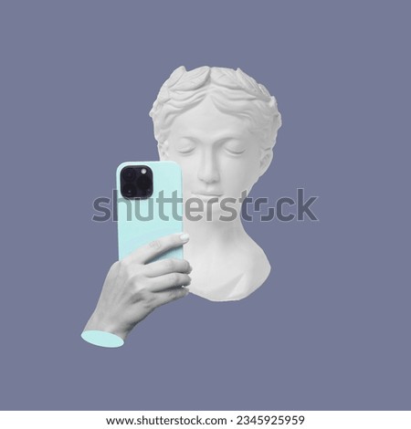 Antique female statue's head holding mobile phone with camera taking a picture or surfing Internet isolated on a violet background. 3d trendy collage in magazine style. Modern design. Contemporary art