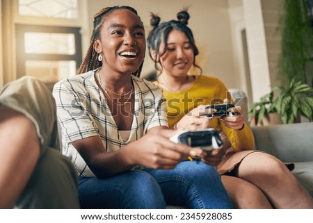 Friends, women and gaming on tv in home living room on sofa, smile and having fun online. Television, girls and play video game on couch, esports competition and bonding to relax in house together