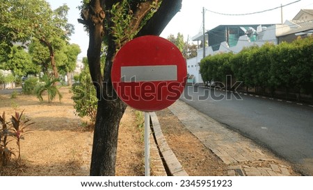stop sign on residential street close to the park