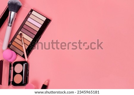 Beauty background with facial cosmetic products with empty copy space. Makeup, skin care concept with pastel colored background.