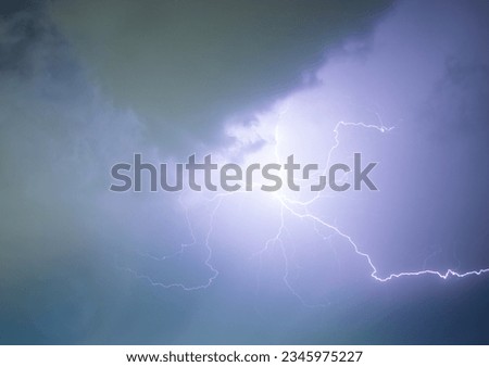 beautiful lightning in the night sky among the clouds during a thunderstorm