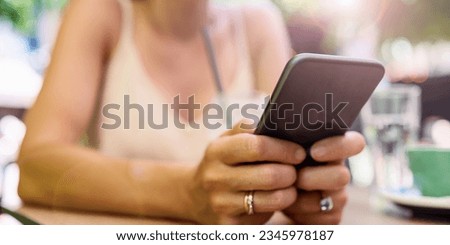 Portable information device in female hands close-up, using smart phone, wi-fi access, portability. Royalty-Free Stock Photo #2345978187